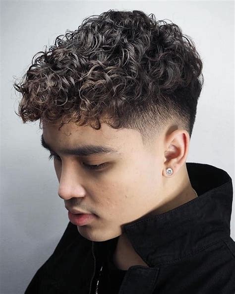 Curly taper boy haircuts. . Mid taper on curly hair